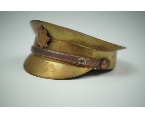 A Great War trench art model of an Army Service Corps cap, 7.5 cm
