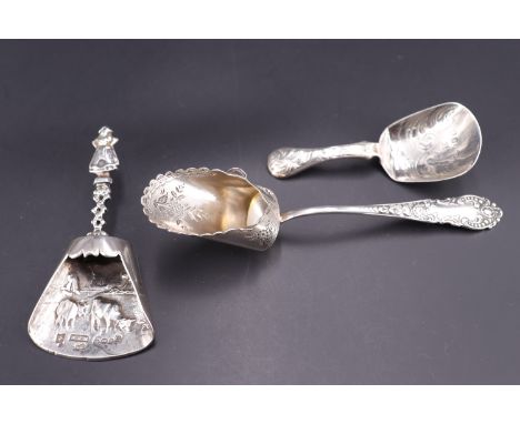 An early 20th Century Dutch silver caddy spoon, London import marks, 1919, together with two other silver caddy spoons