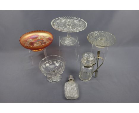 Two pressed glass tazzas / cake stands, a carnival glass bowl, pressed glass bon-bon dish, a hip flask and a cut glass pickle