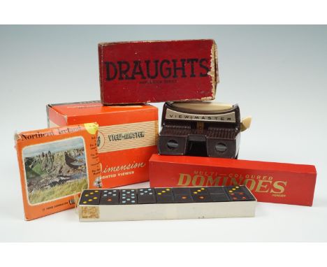 A vintage Viewmaster stereoviewer, together with sets of dominoes and draughts pieces