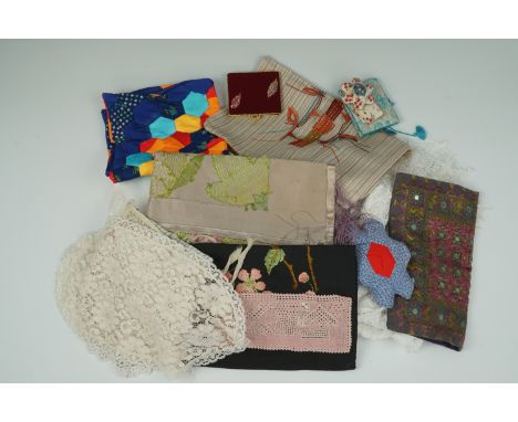 A Damask tablecloth together with sundry vintage embroidered and crocheted textiles, needle wallets and a pin cushion