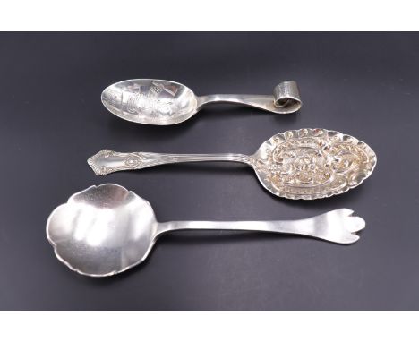 A George V silver trefid pattern caddy or preserve spoon, Harrison Fisher &amp; Co, Sheffield , 1935, together with one other