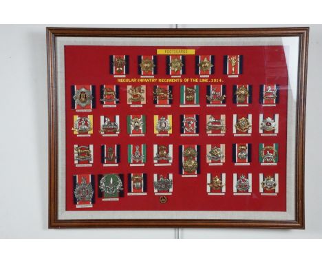 A pair of uniformly framed displays of British army cap badges, 53 cm x 68 cm