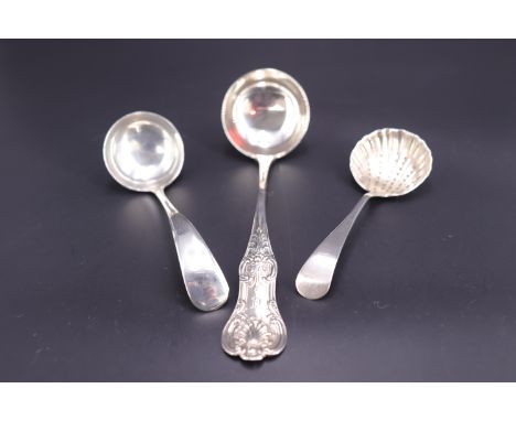 Victorian silver Queen's pattern sauce ladle, Robert Scott, Glasgow, 1849, together with one other silver sauce ladle and a s