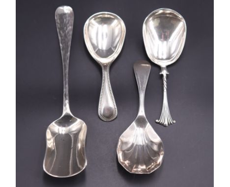Four various silver caddy spoons