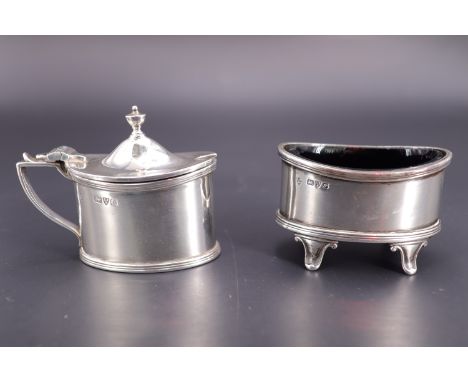 A George V silver salt cellar and mustard pot, each of Georgian-style navette form with cobalt blue glass liner, Haseler Brot