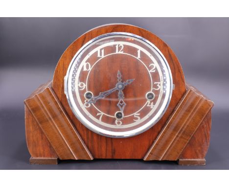 A 1930s - 1940s walnut mantle clock having a three-train movement
