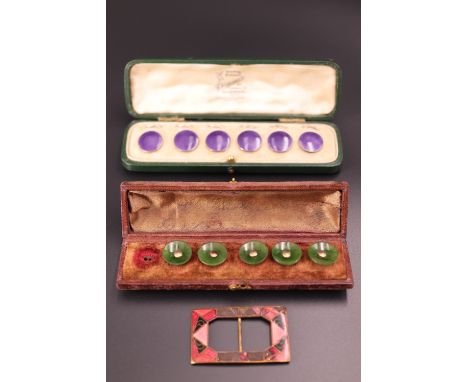 A cased set of Edwardian amethyst-enamelled silver waistcoat buttons together with a cased part set of jade buttons with yell
