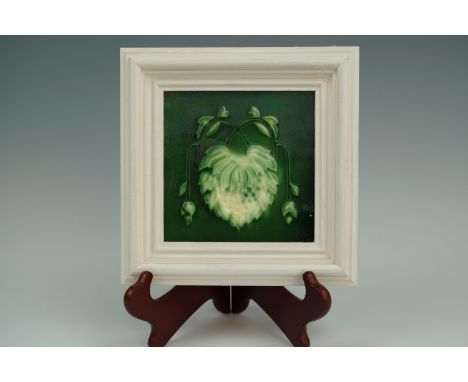 A framed Victorian hops pattern ceramic hearth tile, 22 cm