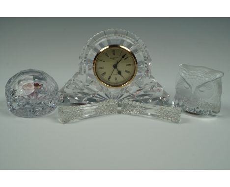 A Waterford Crystal clock, 18 cm x 12 cm, together with a Wedgwood paperweight, a Nubro Swedish owl paperweight and a pair of