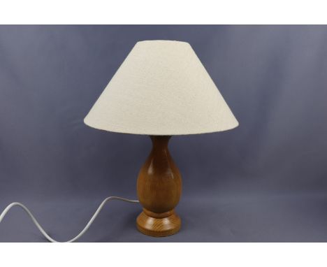 A turned beech table lamp by Gisla Woodcraft of the Isle of Lewis, 38 cm