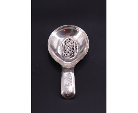 A George III engraved and filigree-inset silver caddy spoon, sponsor's mark indistinct, Birmingham, 1802, (old repair)
