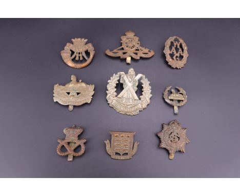 Sundry Victorian and early 20th Century British army cap badges including a Victorian Ordnance Corps cap badge and early Glou