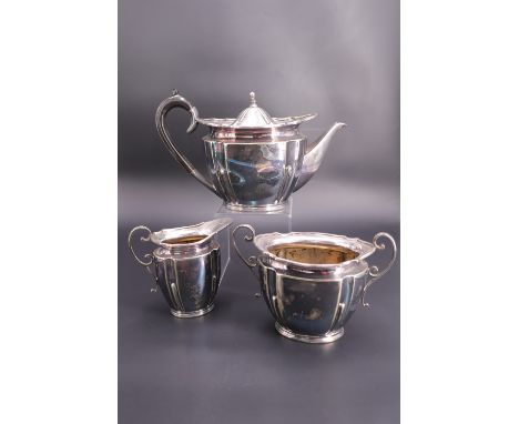 An early 20th Century electroplate three-piece tea service retailed by Maple &amp; Co