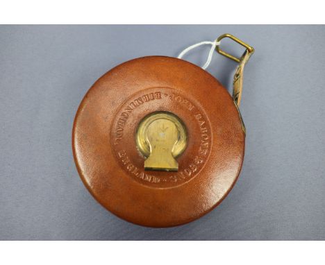 A vintage Rabone leather-covered Imperial tape measure, the brass crank bearing a struck British military / Ordnance broad ar