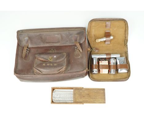 A vintage hide document valise / briefcase, circa 1930s - 1950s, together with a travel grooming set and Rolls razor strop