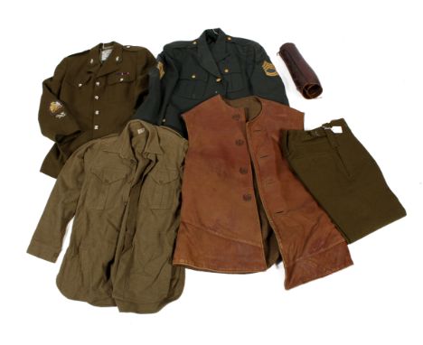  A quantity of military clothing. Including a large leather gillet, a green jacket with USA Air Force buttons and with a Japa