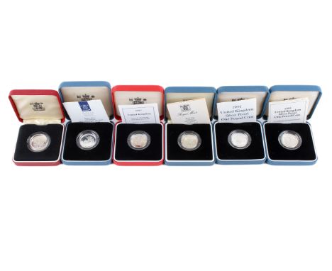 A group of six silver proof £1 coins. Dated 1983, 1986, 1990, 1991, 1993 & 2002