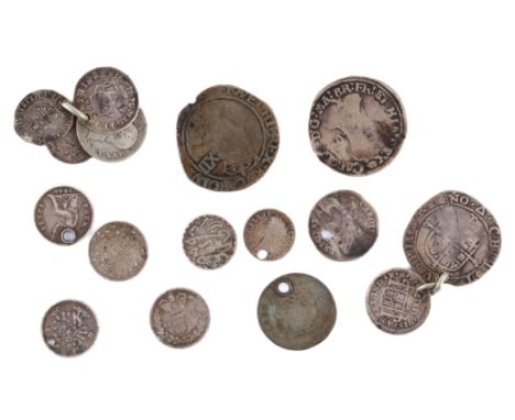 A small group of old silver coins. Including Charles I shilling and two sixpences etc.