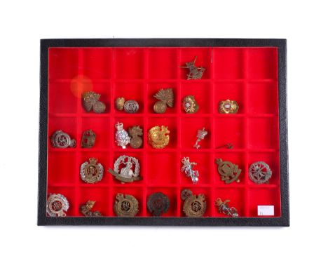 A collection of Royal Engineers and other military badges. Including Royal London Fusiliers, 19th Hussars elephant, Royal Arm