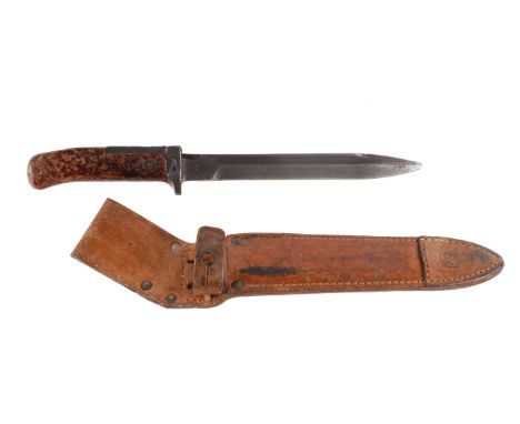A Czechoslovakian VZ-58 knife bayonet. Marked 73H 19 and 188, blade 17cm, in a leather scabbard. 