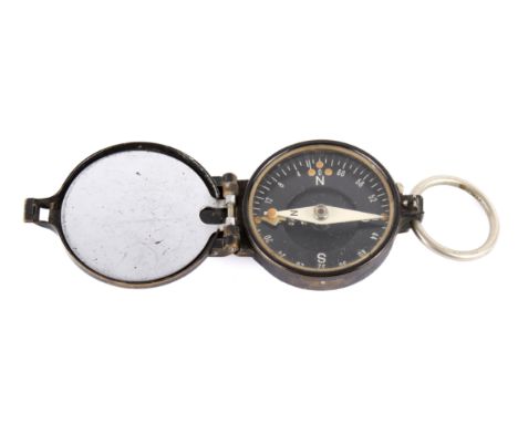A 1934 German army marching compass. Made by Busch, marked DRGM and numbered 293(?)74, dated 1934.