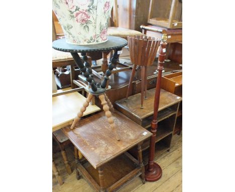 An oak bookcase, a standard lamp, a plant stand, a dining chair, and Edwardian occasional table and a turned tripod table