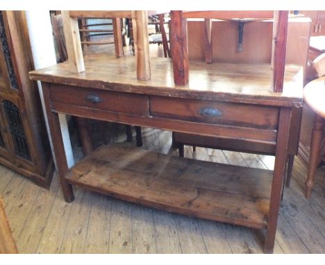 A Victorian two drawer pine serving table with shelf to underneath