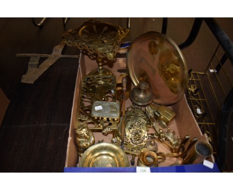 A box full of interesting brass collectables including a money box in the shape of a bear, trivets, alligator nut cracker,and
