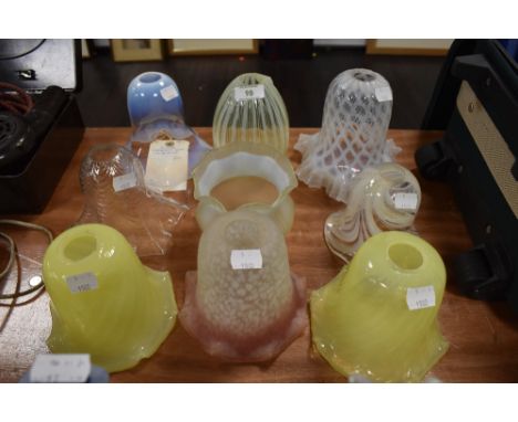 A collection of nine antique lamp shades including Uranium/Vaseline glass and similar, some unusual colours and shapes.
condi