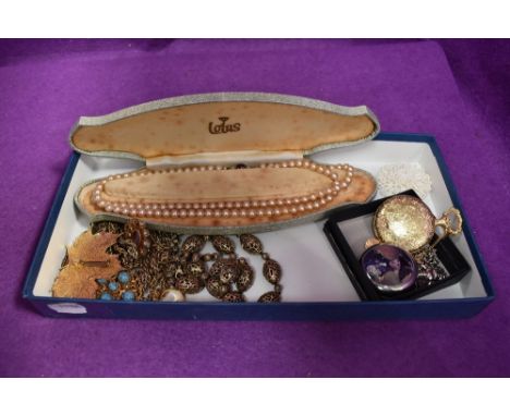 A selection of costume jewellery including pocket watches, leaf brooch, simulated pearls, Monet necklace, etc