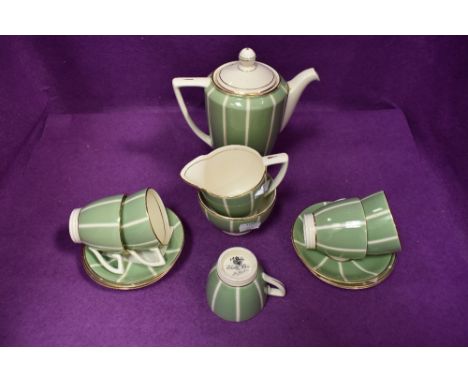 A part Mintons Solano ware coffee set designed by John Wadsworth comprising of five cups , six saucers,sugar and creamer and 