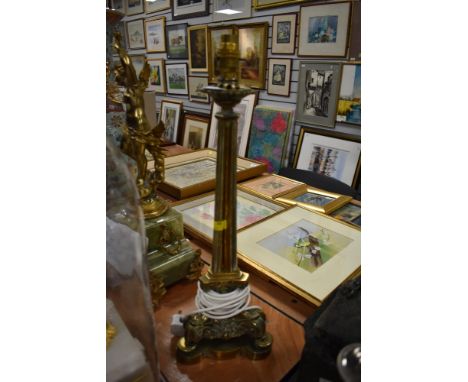 An impressive large brass table top lamp having ornate detail to base.