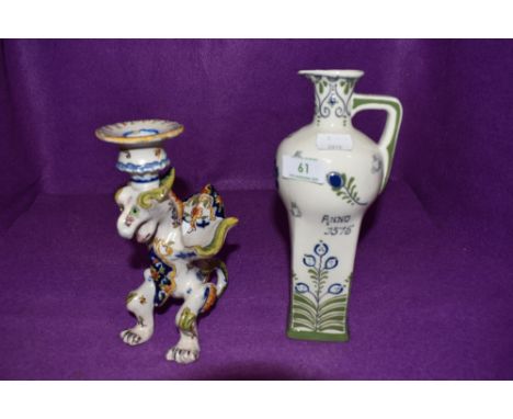 Two ceramics in Dutch designs including hand decorated figural dragon candle stick