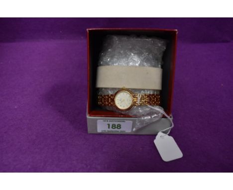 A lady's Junghans gold plated wrist watch having baton dial and bracelet strap