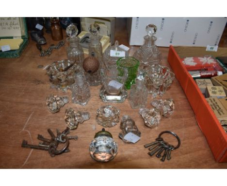 A collection of vintage and antique glass including bottle stoppers, perfume bottles and trinket bowls and vases.