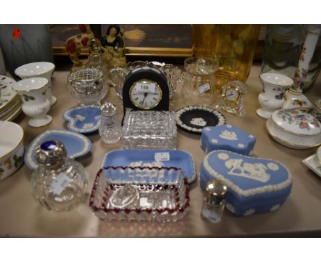 A election of Wedgewood including clock and trinket boxes, also some glass with two bottle having hallmarked silver tops.