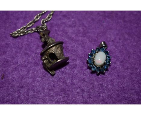 An opal and sapphire style stone cluster pendant set in white metal stamped 925 and a white metal pendant and chain stamped 9