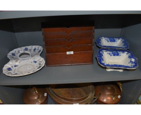 A graduated mahogany Edwardian letter rack and selection of ceramic serving dishes