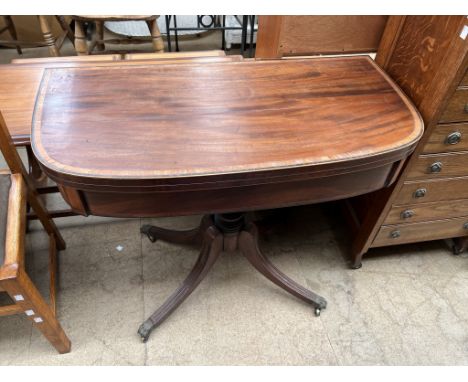 A 19th century mahogany card table of D shape with a crossbanded top enclosing a baize interior on a turned column on four sp