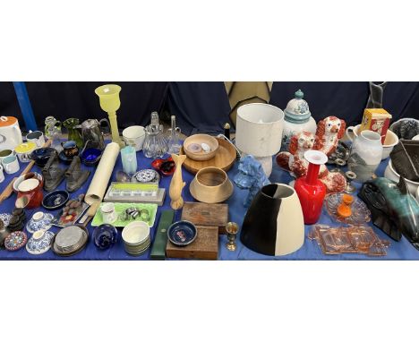 A pair of Staffordshire dogs together with a Sylvac dog, pottery dolphin, treen bowls, silver desk candlesticks, flat irons, 