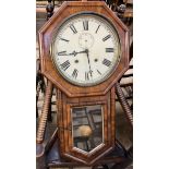 A walnut drop dial wall clock, with an octagonal frame and glazed door,