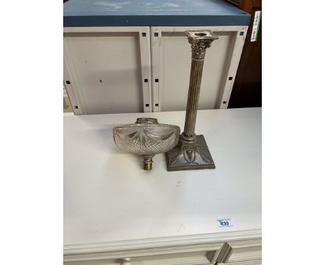 An electroplated candlestick of corinthian column with a square base and swags, together with a glass oil lamp reservoir adap