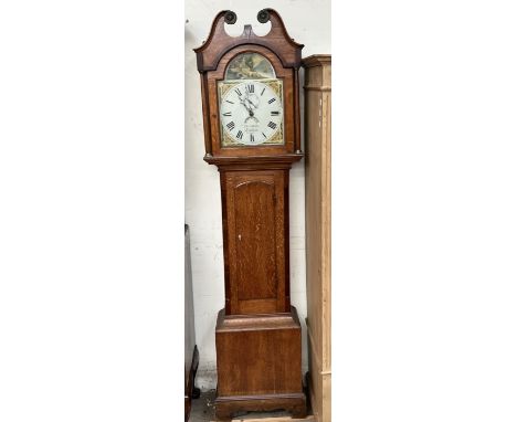 A 19th century oak longcase clock, the hood with a broken  swan neck pediment and columns, above a long trunk door, box base 