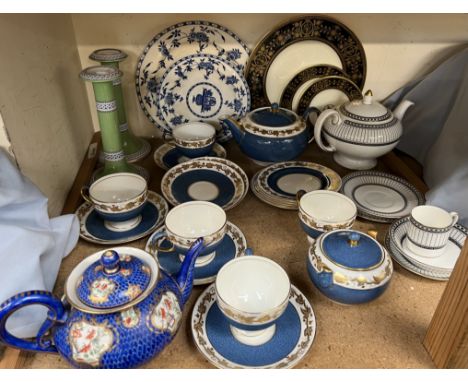 A Wedgwood powder blue part tea set together with a scale blue decorated teapot, a pair of pottery candlestick, Wedgwood colo