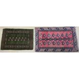 A red ground rug with central tree pattern and multiple guard stripes,