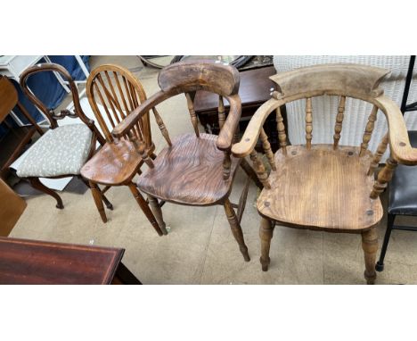 A smokers bow elbow chair, together with another similar, a stick back dining chair and a Victorian rosewood balloon back din