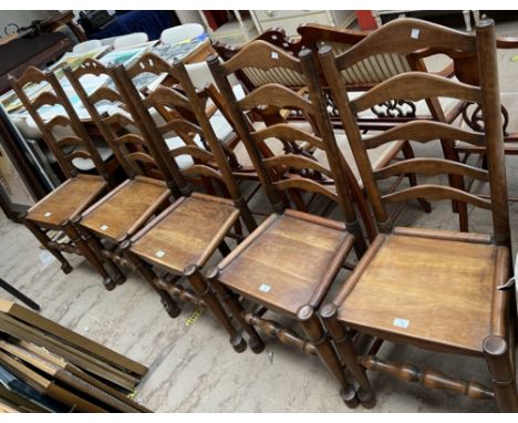 A set of five 18th century style ladder back dining chairs with solid seats on turned legs