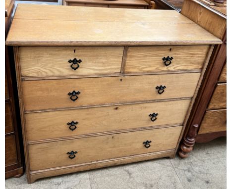 An Edwardian ash chest with a rectangular top above two short and three long drawers on bracket feet