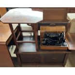 An oak coffer with a rectangular top above a two panel front on turned legs together with an
